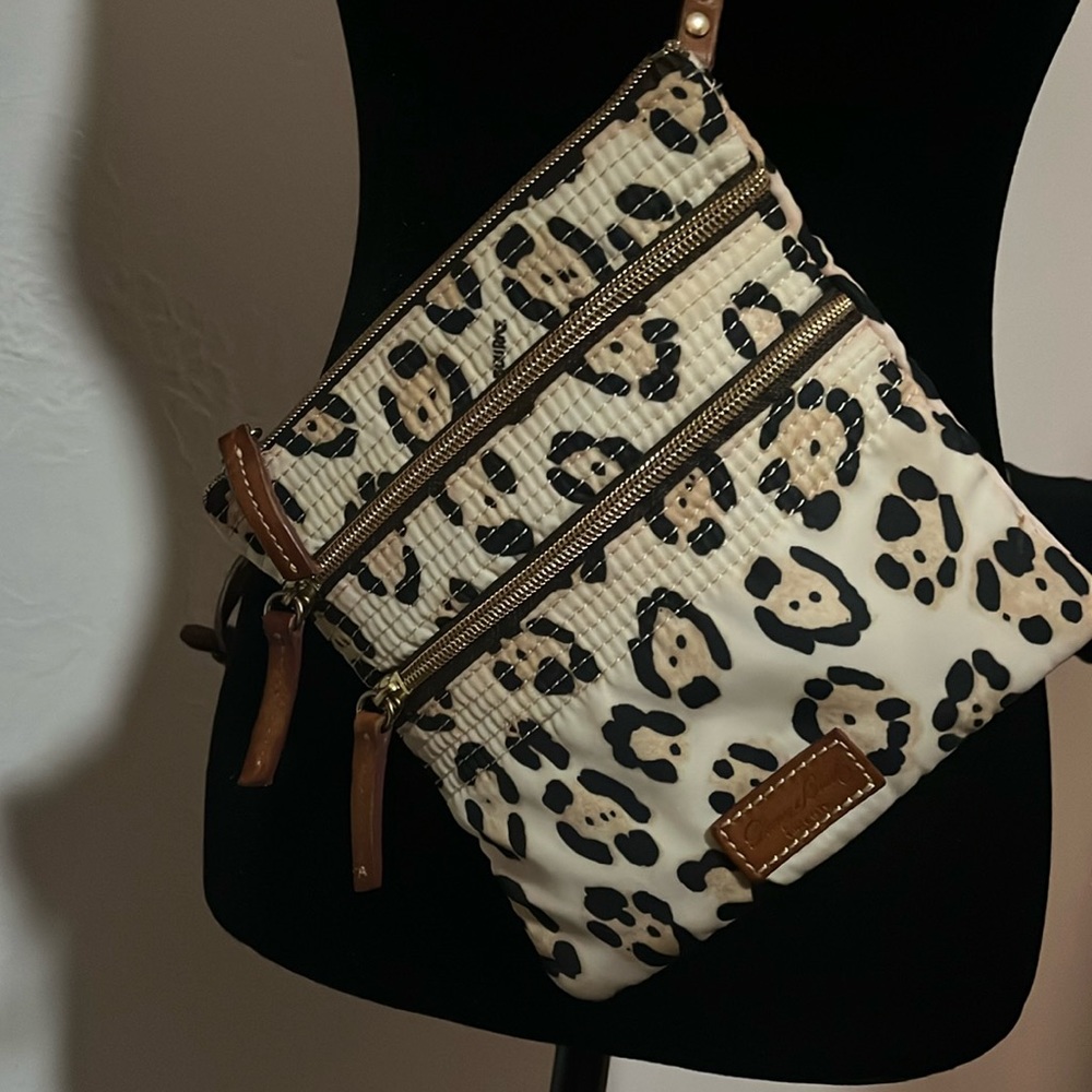 Dooney and Bourke, small cheetah print purse, long leather strap three zippers